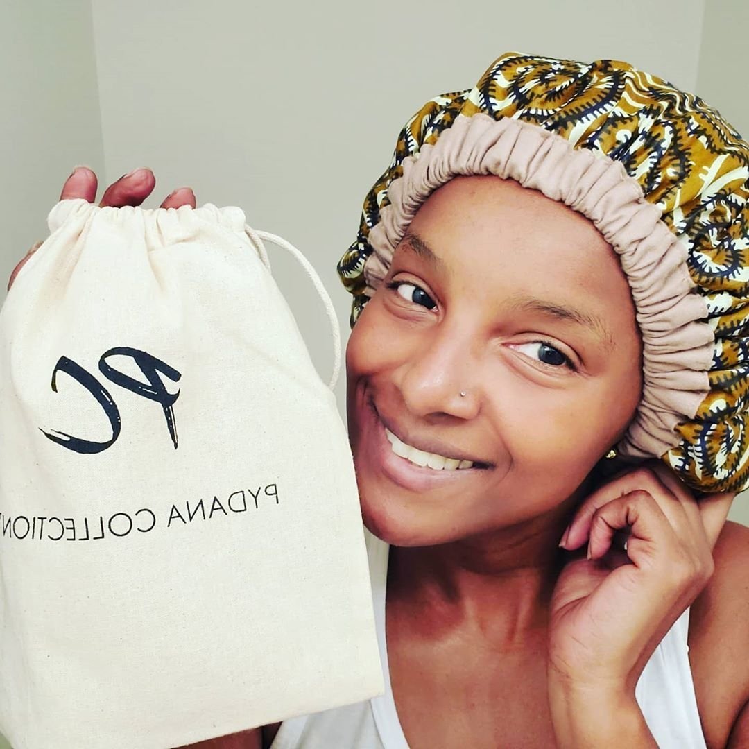 Woman wearing a deep conditioning heat cap aka Pydana Thermal Cap